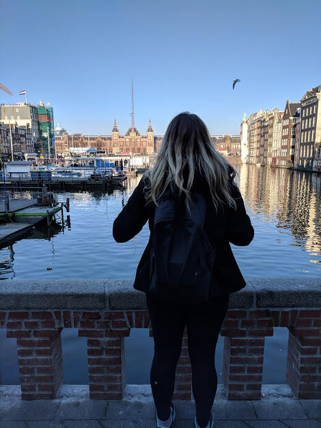 Student overlooking canal
