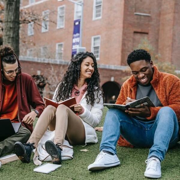 Three students studying at a european university campus