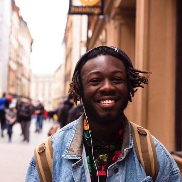 Education abroad student smiling on the streets of european city